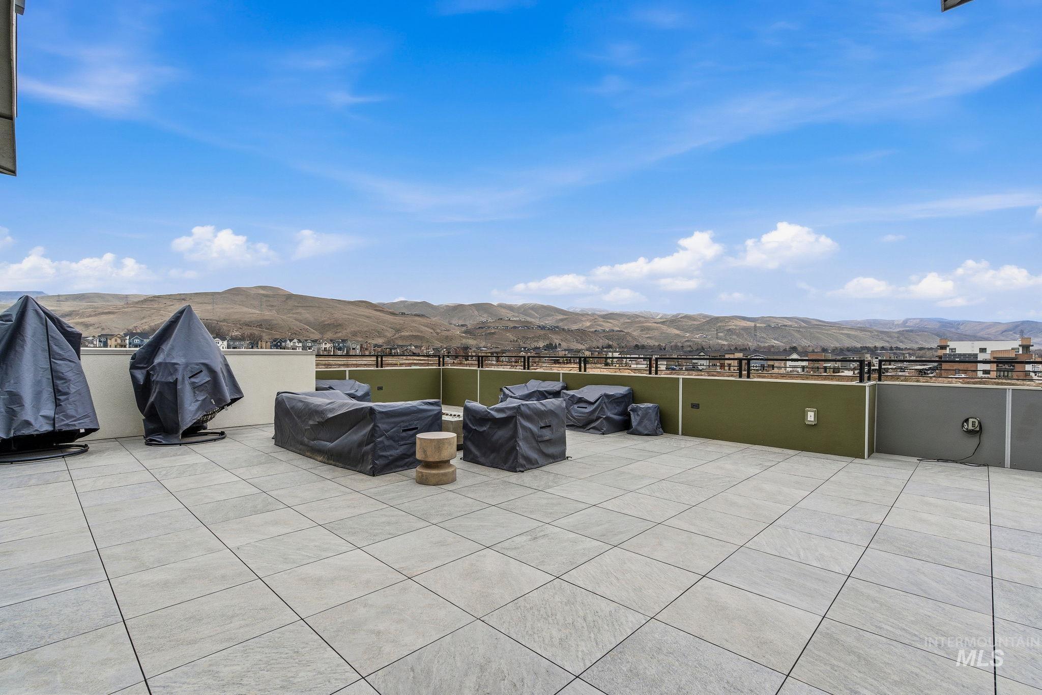 View of patio / terrace with a mountain view and area for grilling