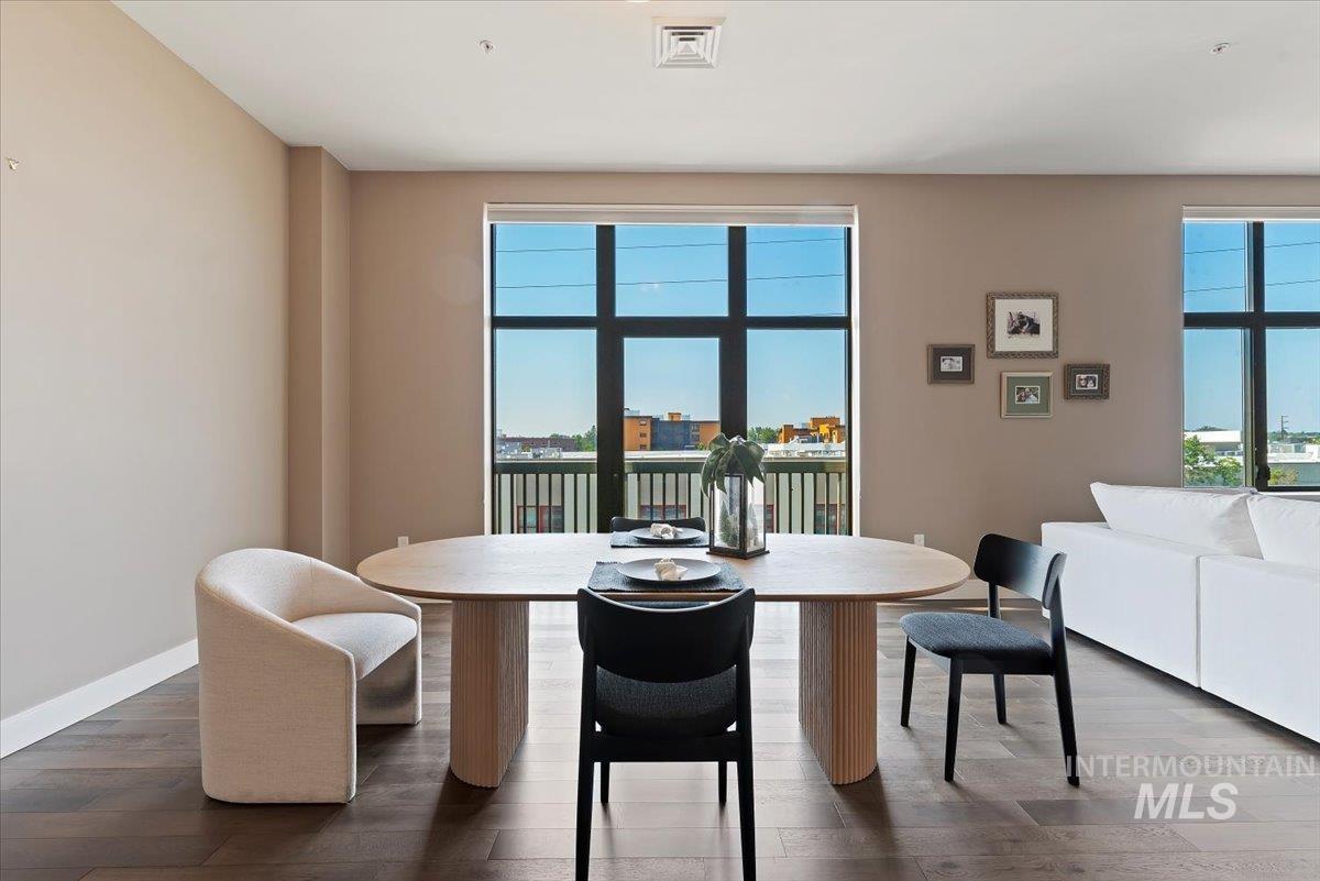 Dining room with wood finished floors and baseboards
