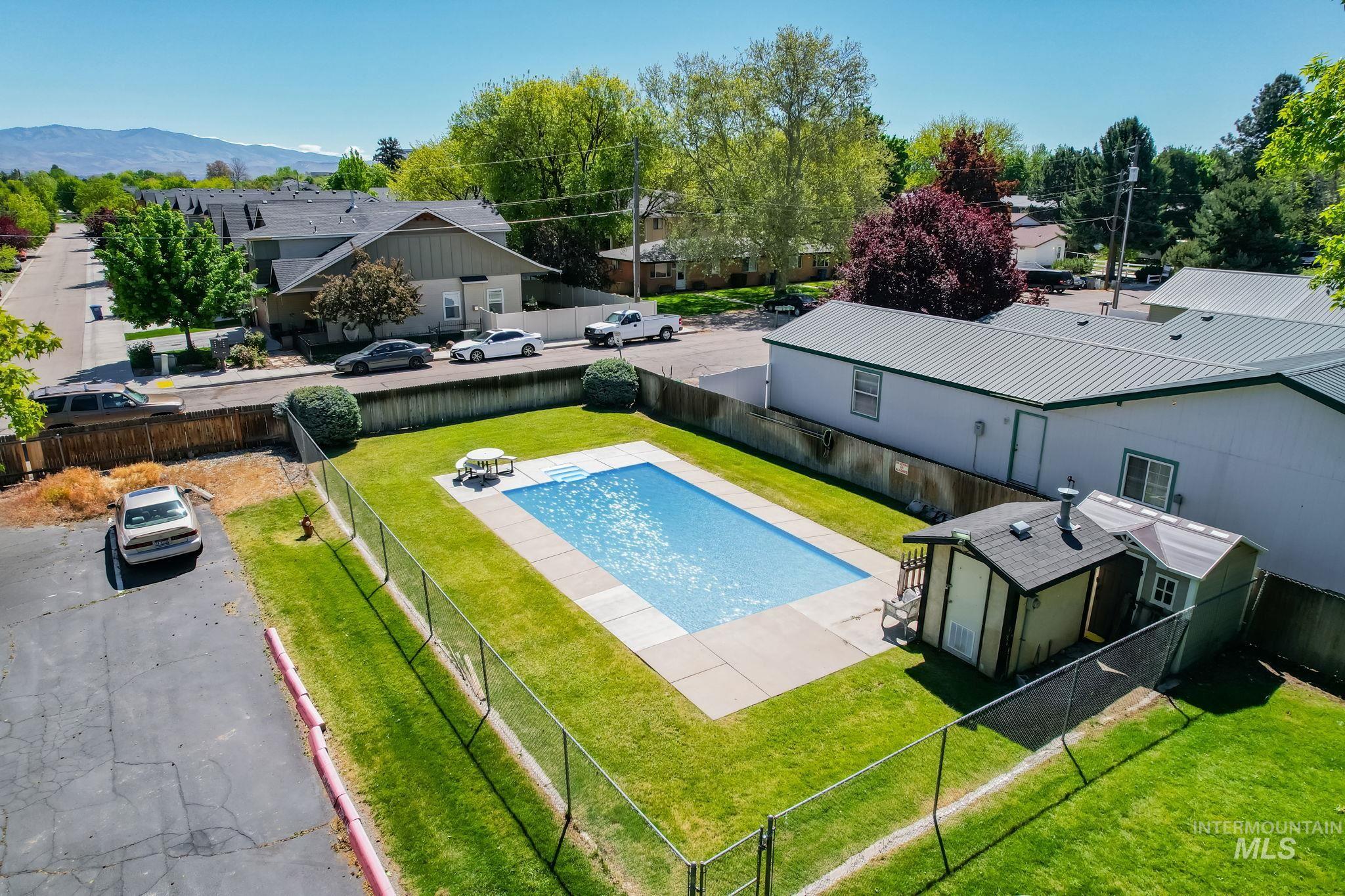 Aerial view of residential area with a pool area