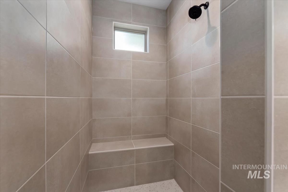 Bathroom view of a tile shower