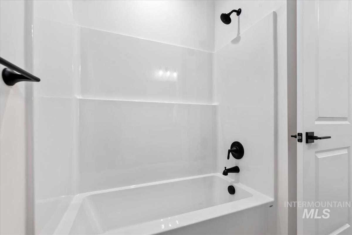 Full bathroom with shower / bath combination