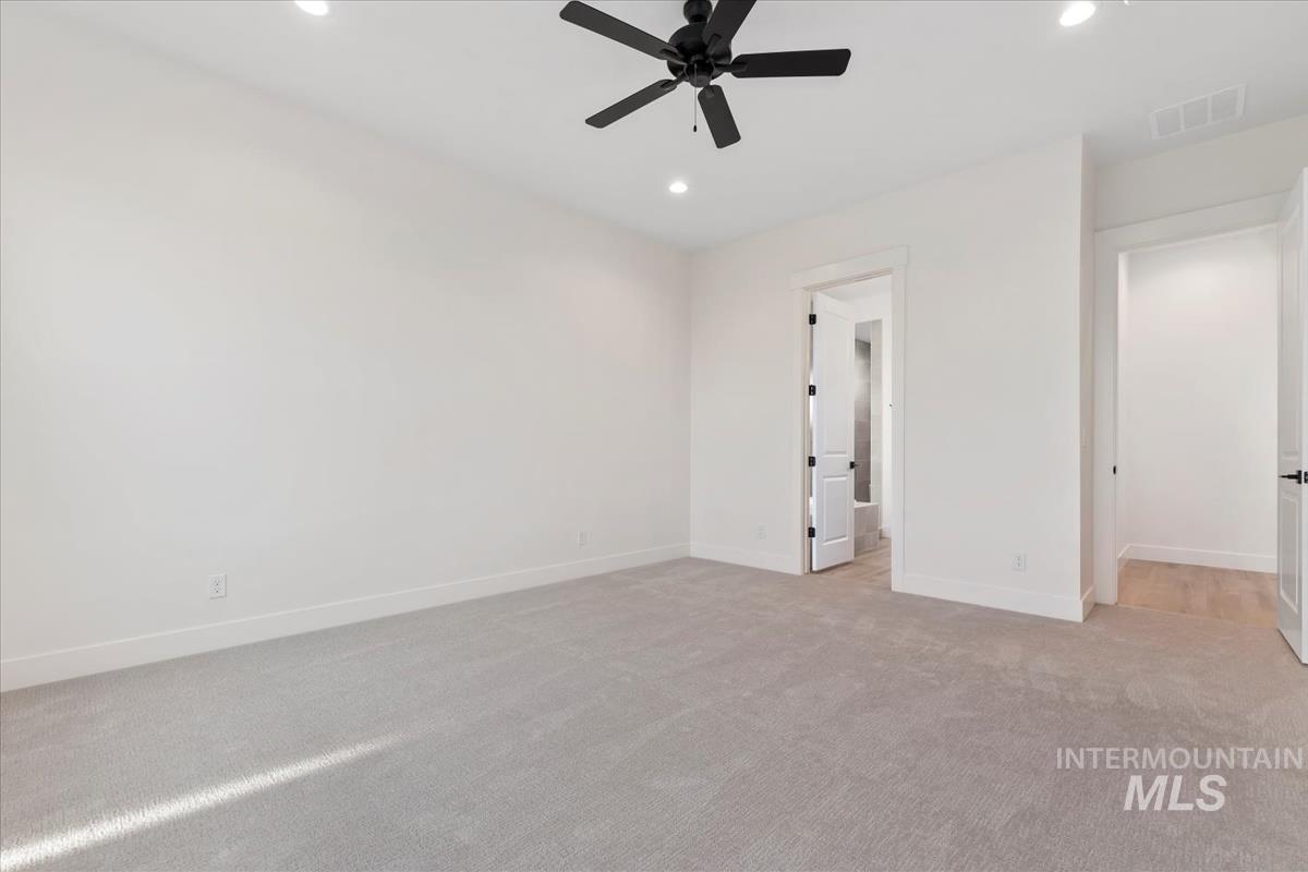 Unfurnished bedroom with light carpet, recessed lighting, and ceiling fan