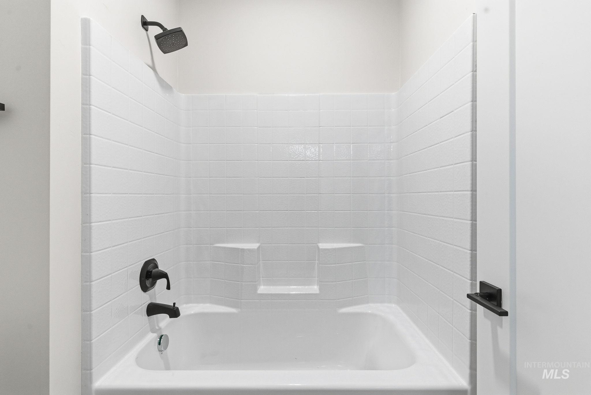 Bathroom featuring shower / washtub combination