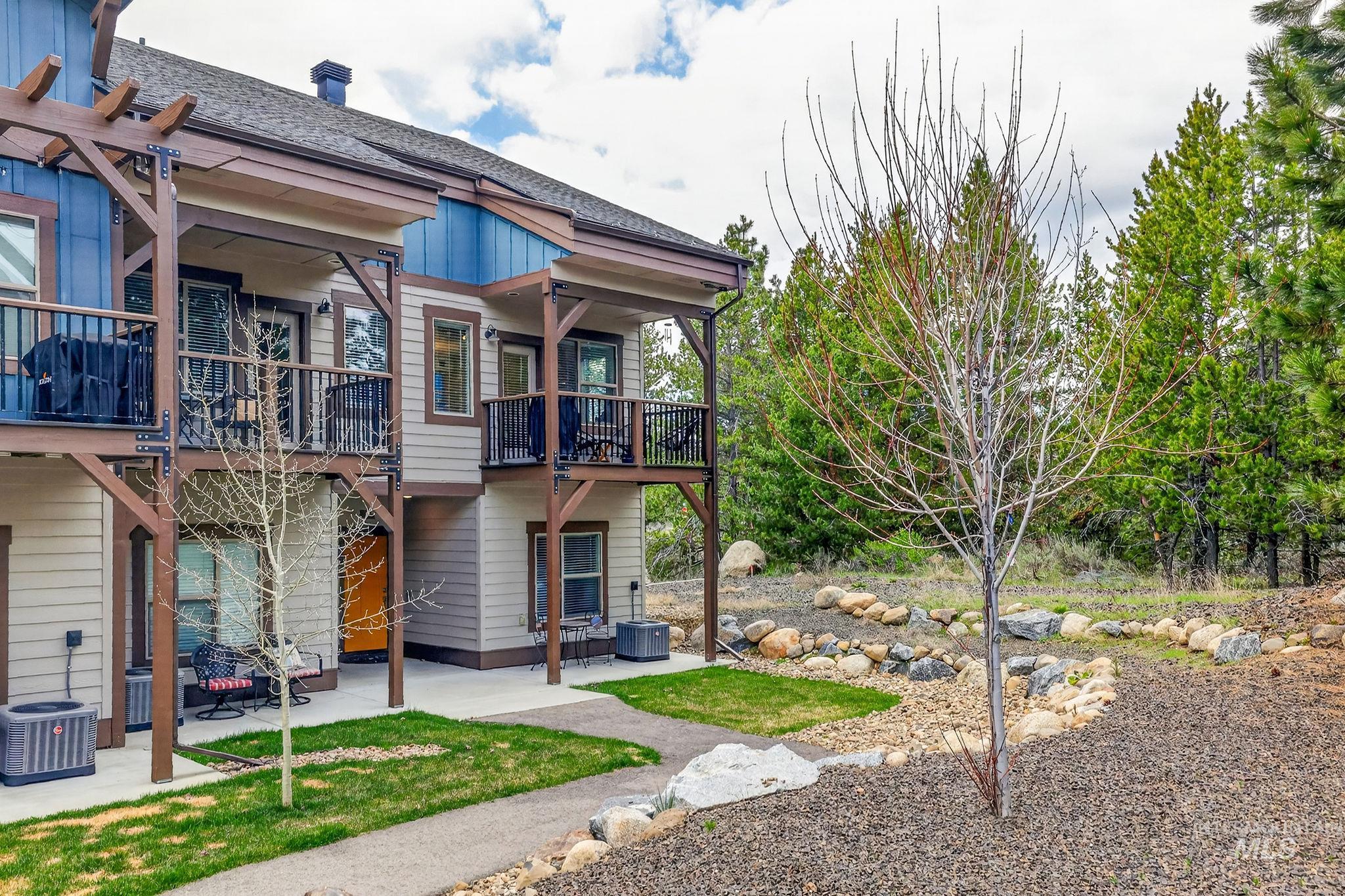 Contemporary multi-level exterior with durable siding and multiple private balconies