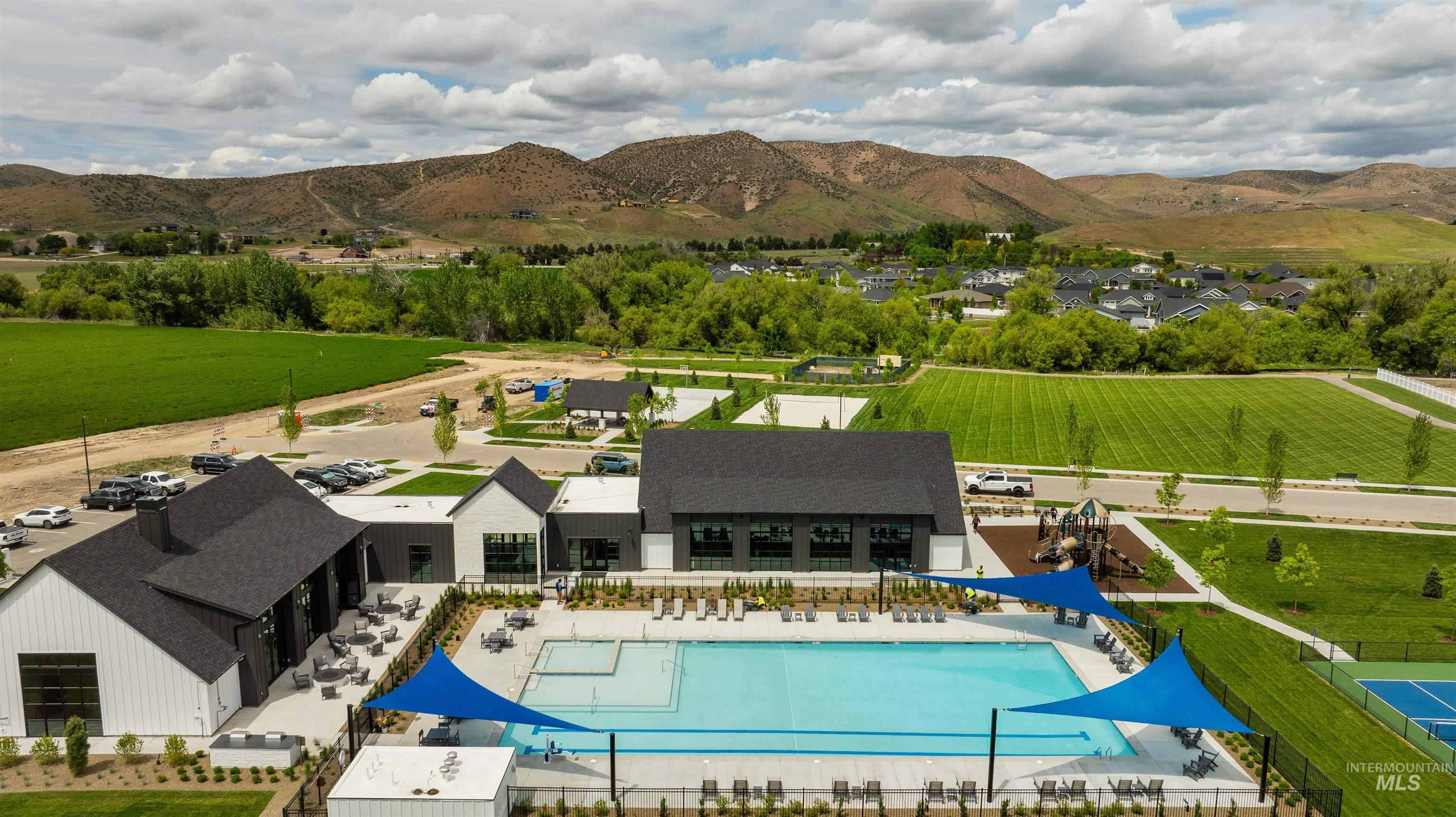 View of pool with a mountain view