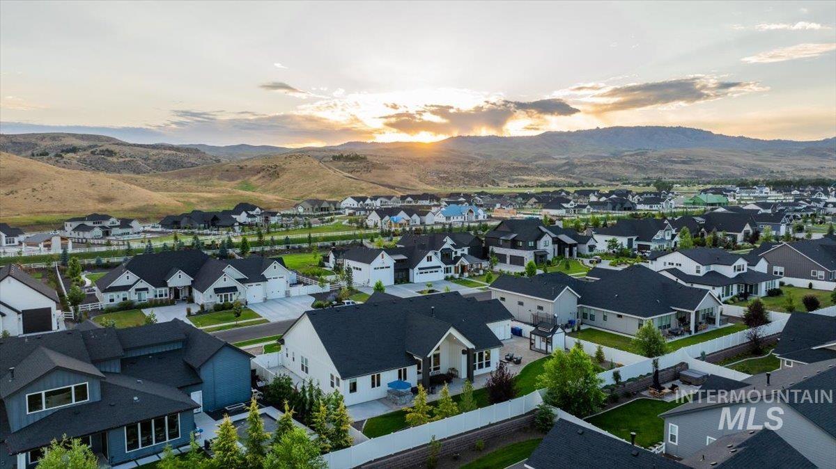 Aerial view at dusk of a residential view and a mountain view