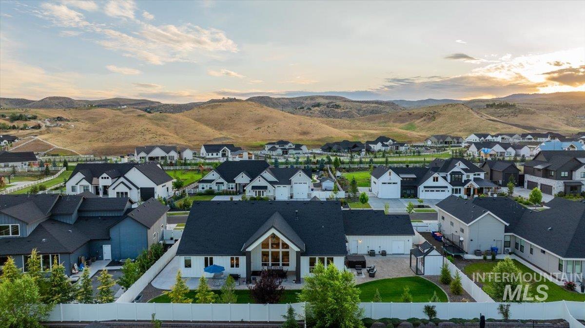 Aerial perspective of suburban area featuring a mountain backdrop
