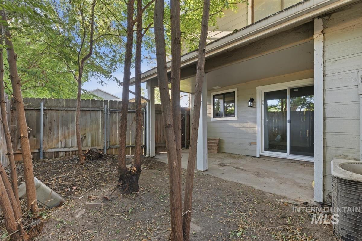 Covered patio with concrete surface, exterior siding, and a sliding glass door