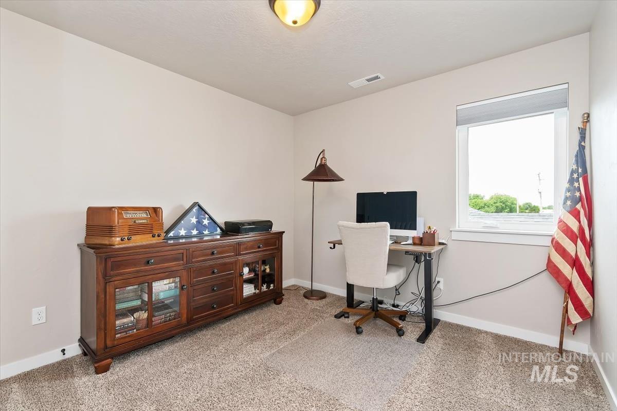 Office featuring carpet flooring and baseboards