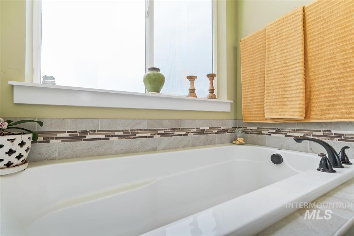 Full bathroom with a bath