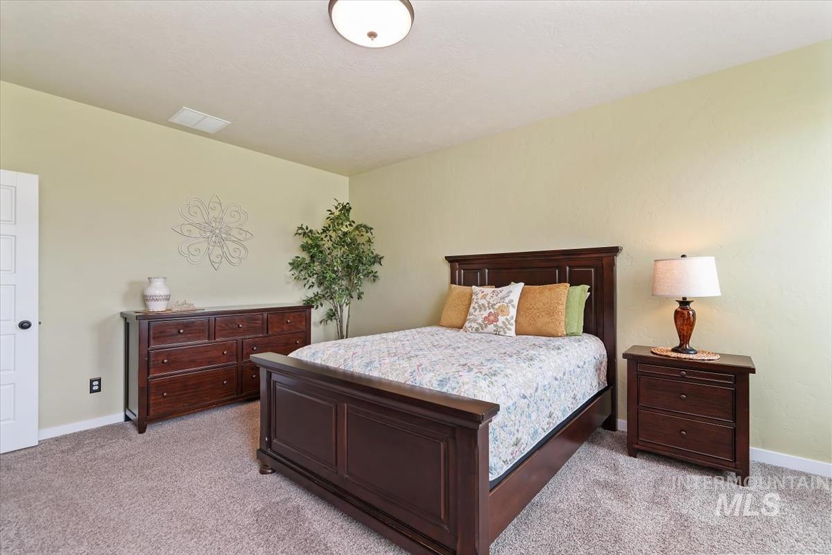 Bedroom with light carpet