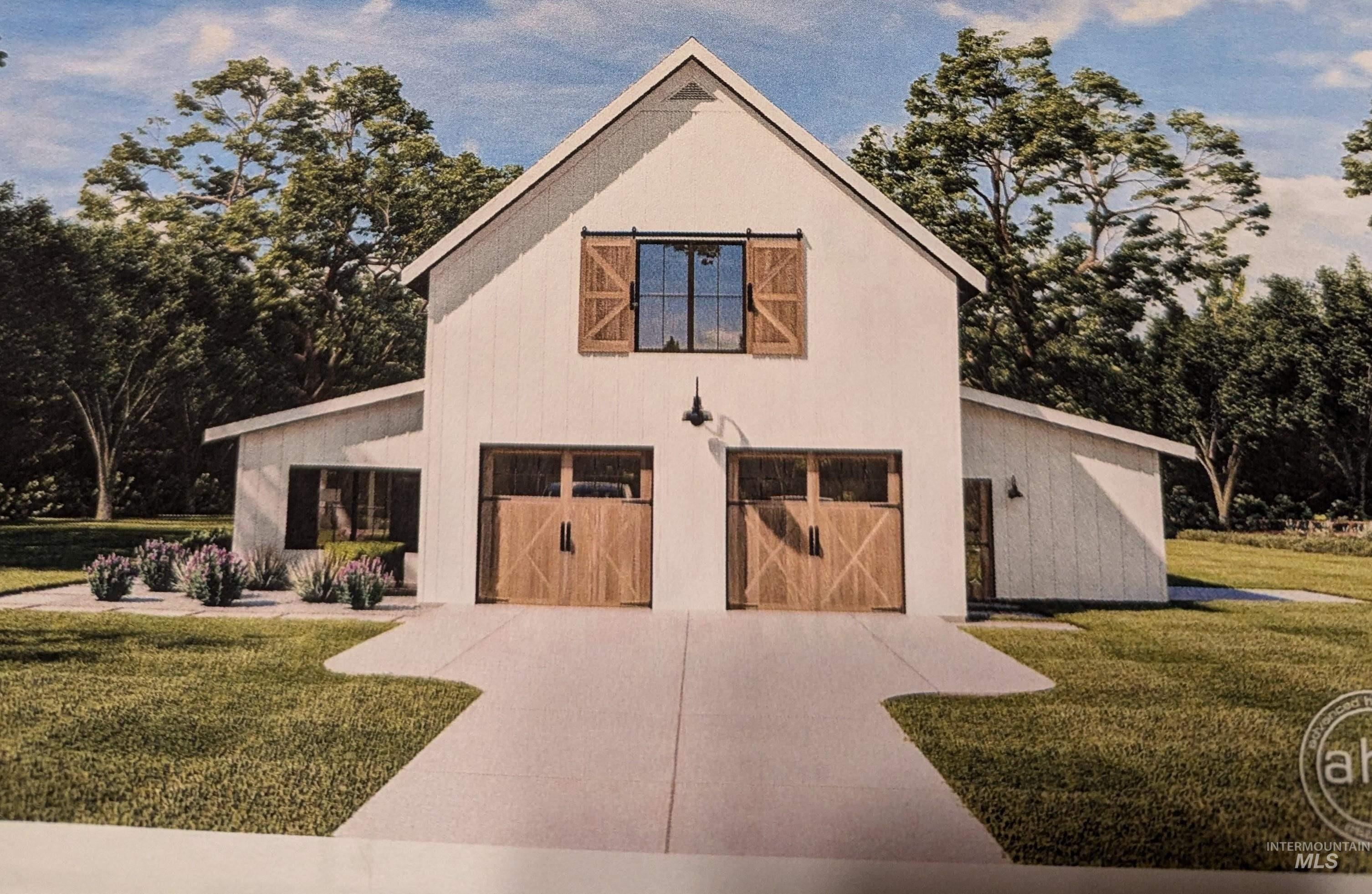 View of back of property featuring a yard, a garage, and concrete driveway