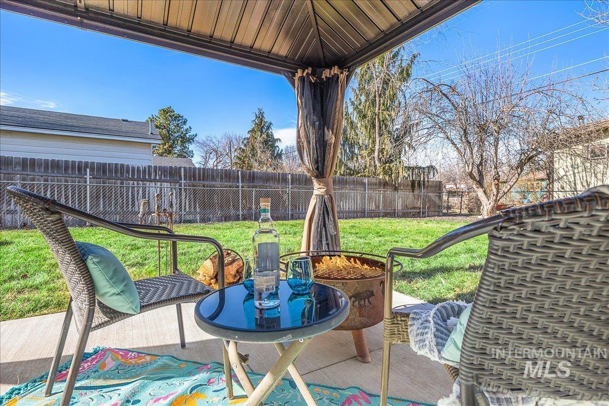 Fenced backyard with a patio