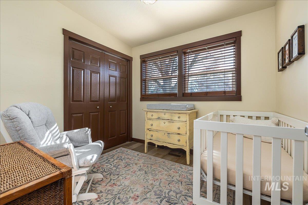 Bedroom with a closet and wood finished floors