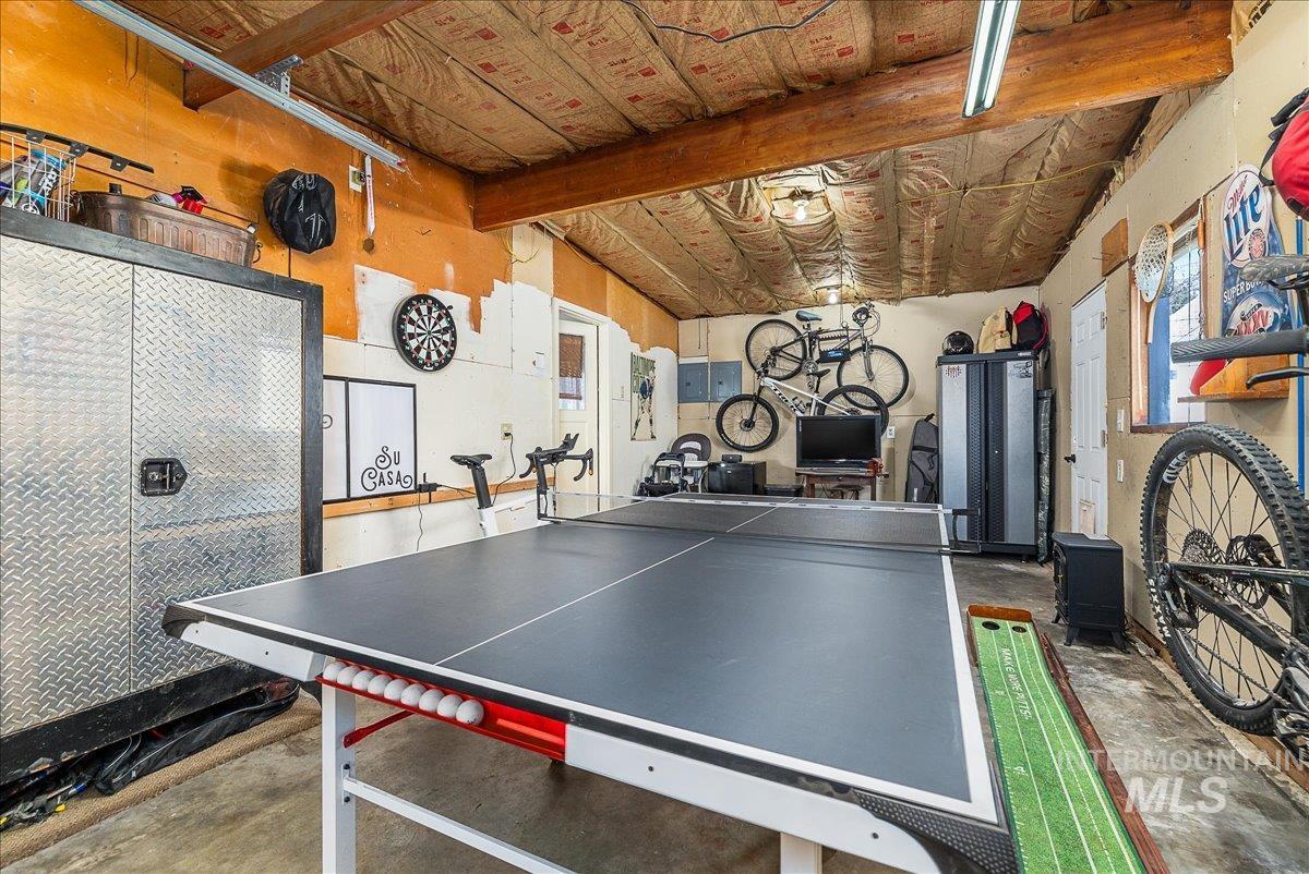 Playroom featuring unfinished concrete flooring