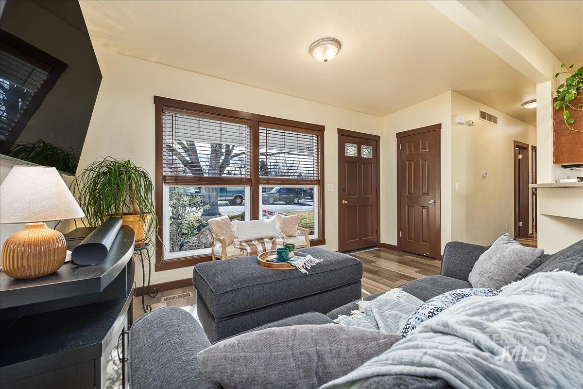 Living area featuring wood finished floors and baseboards