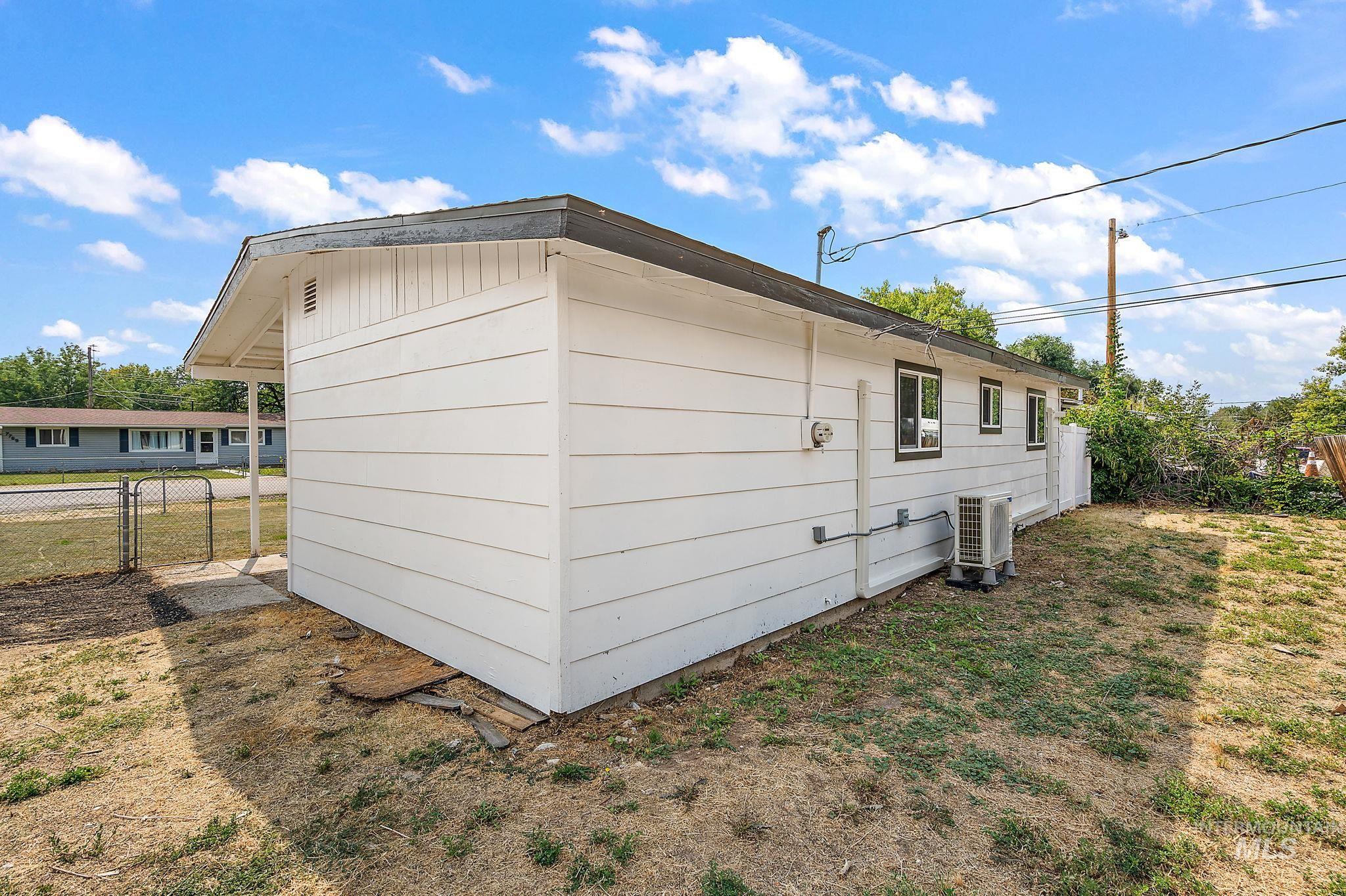 View of side of property featuring an ac unit