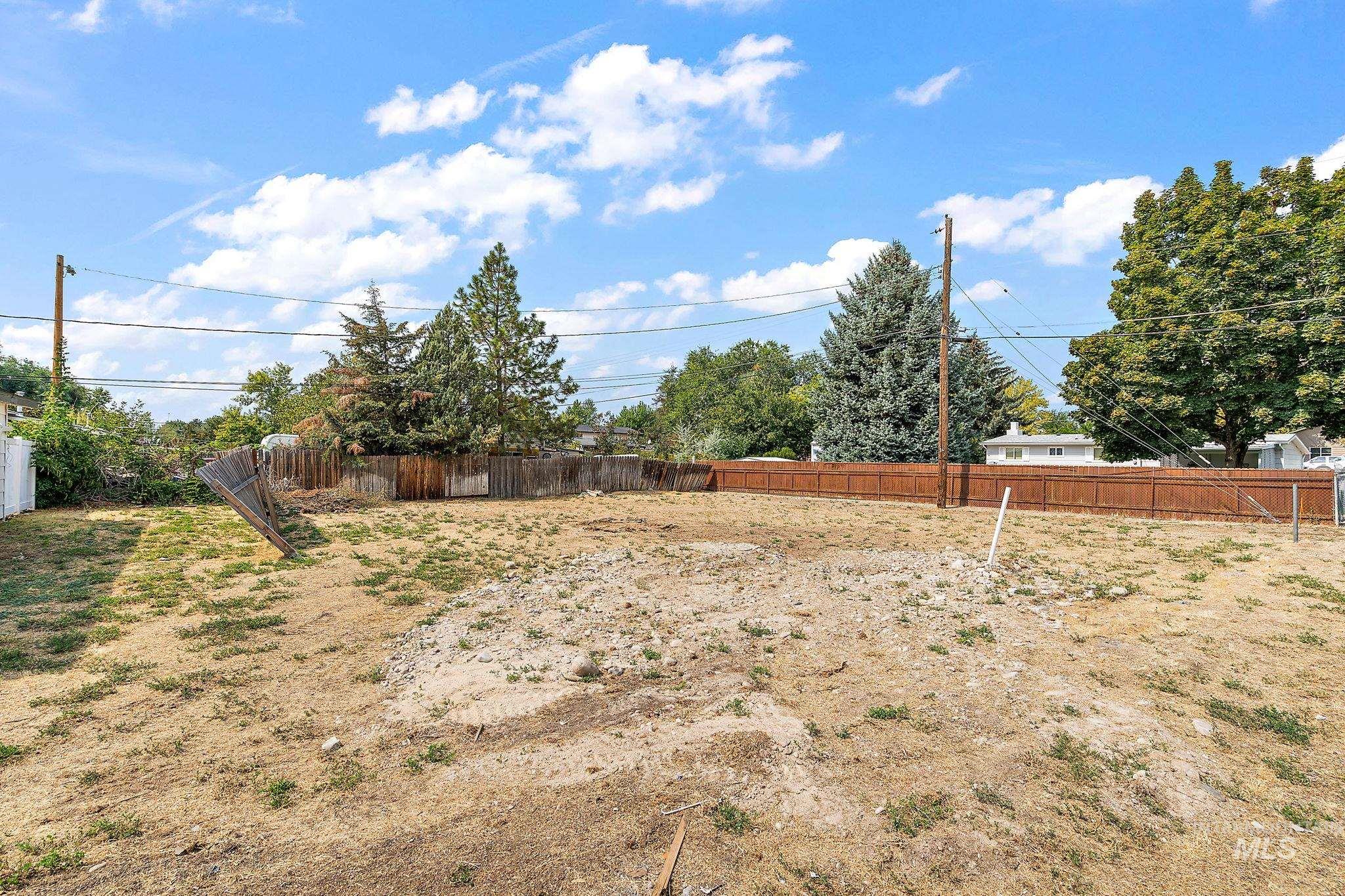 View of fenced backyard