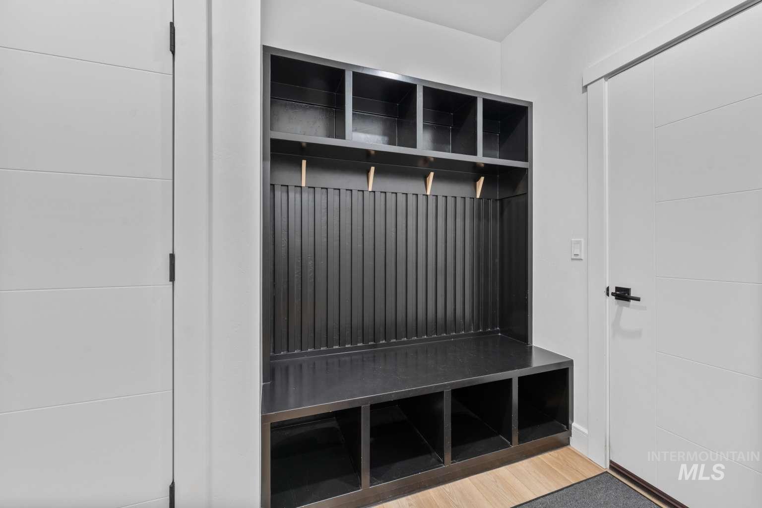 Mudroom with light wood-style flooring
