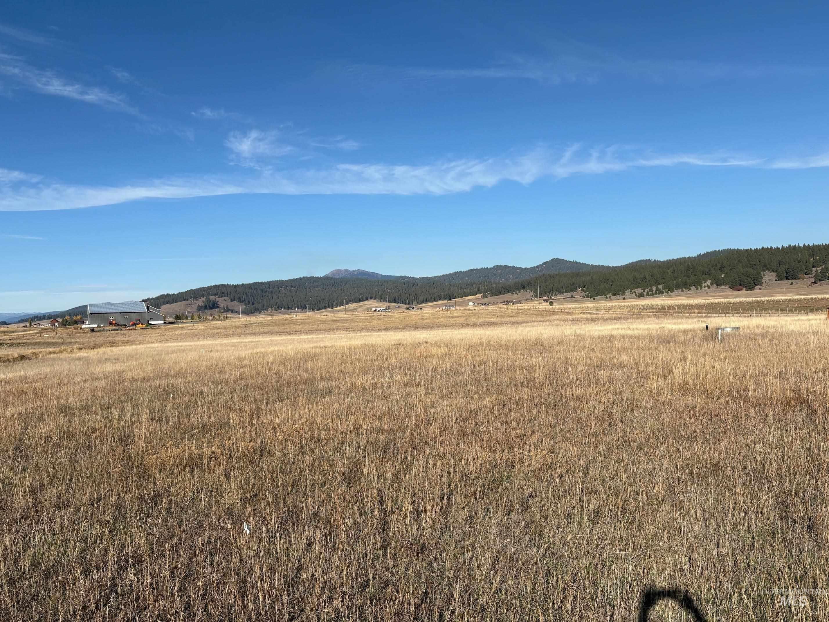 View of mountain backdrop featuring rural landscape