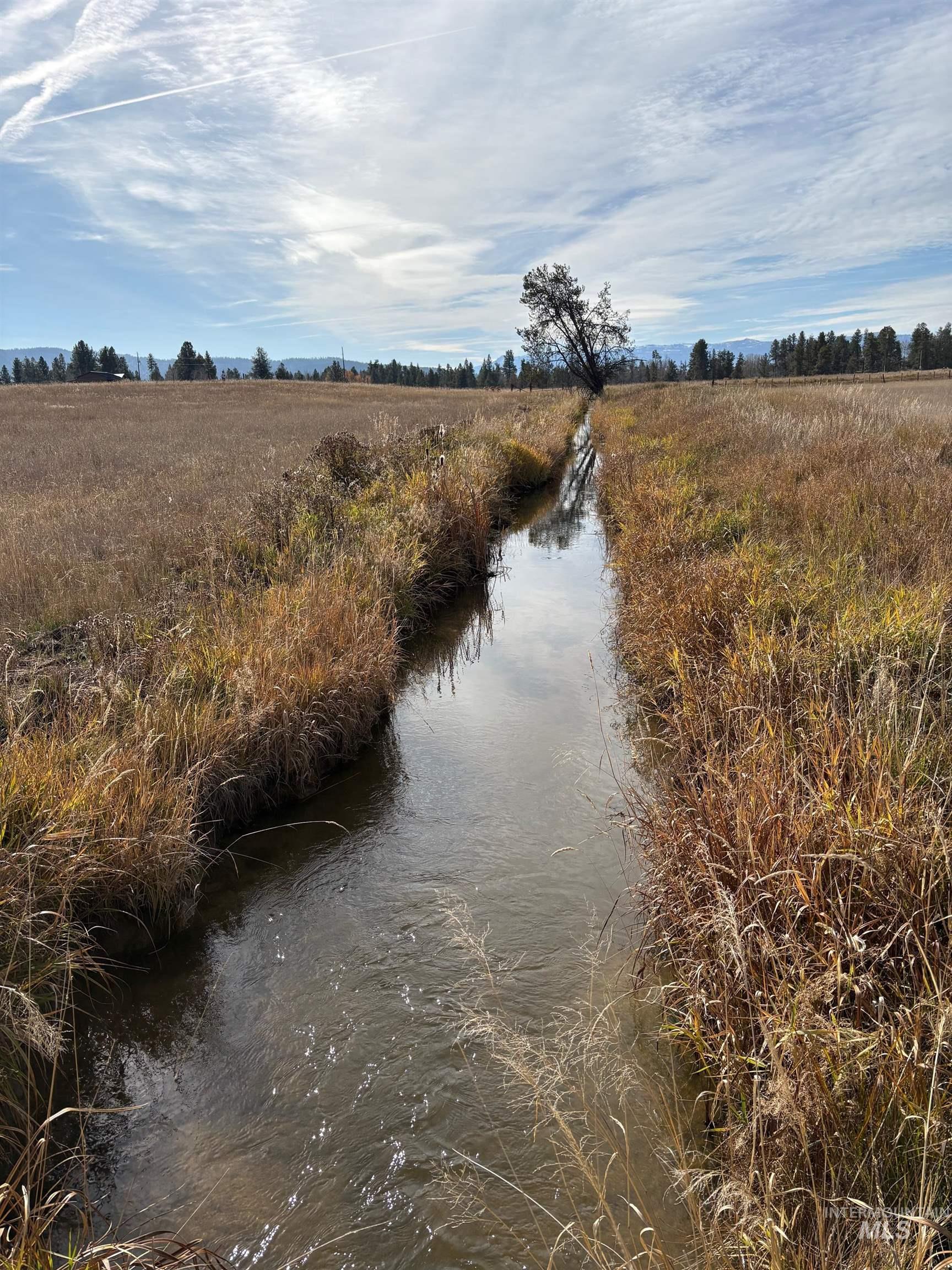 Water view with rural landscape