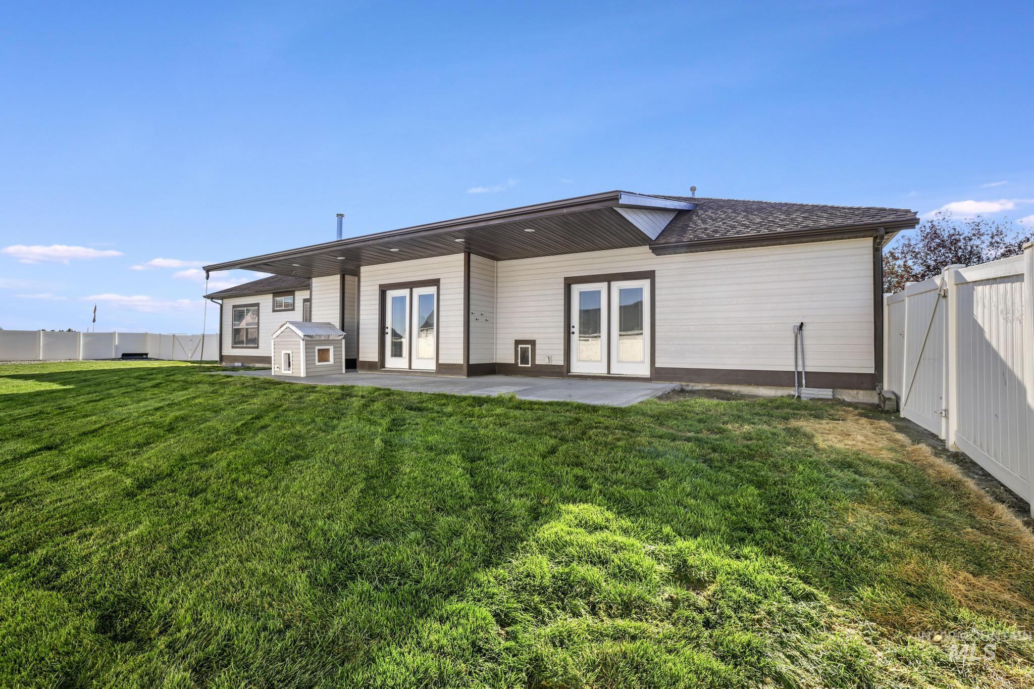 Back of house with a patio area and a fenced backyard