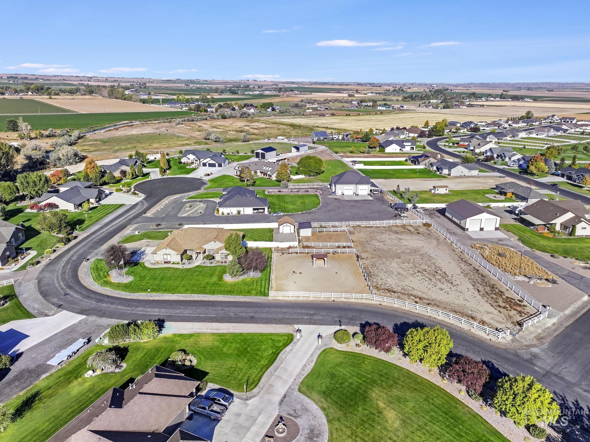 Aerial overview of property's location featuring nearby suburban area