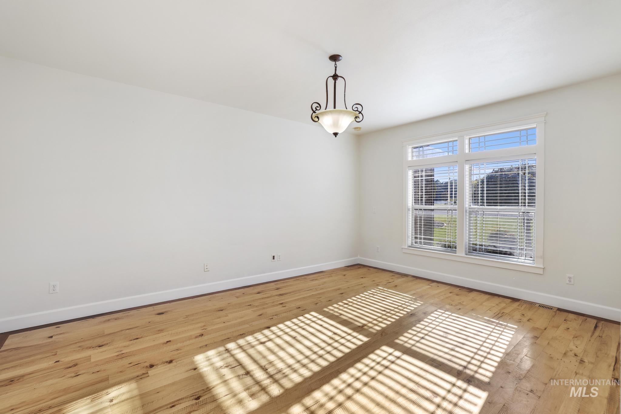 Empty room featuring light wood-type flooring
