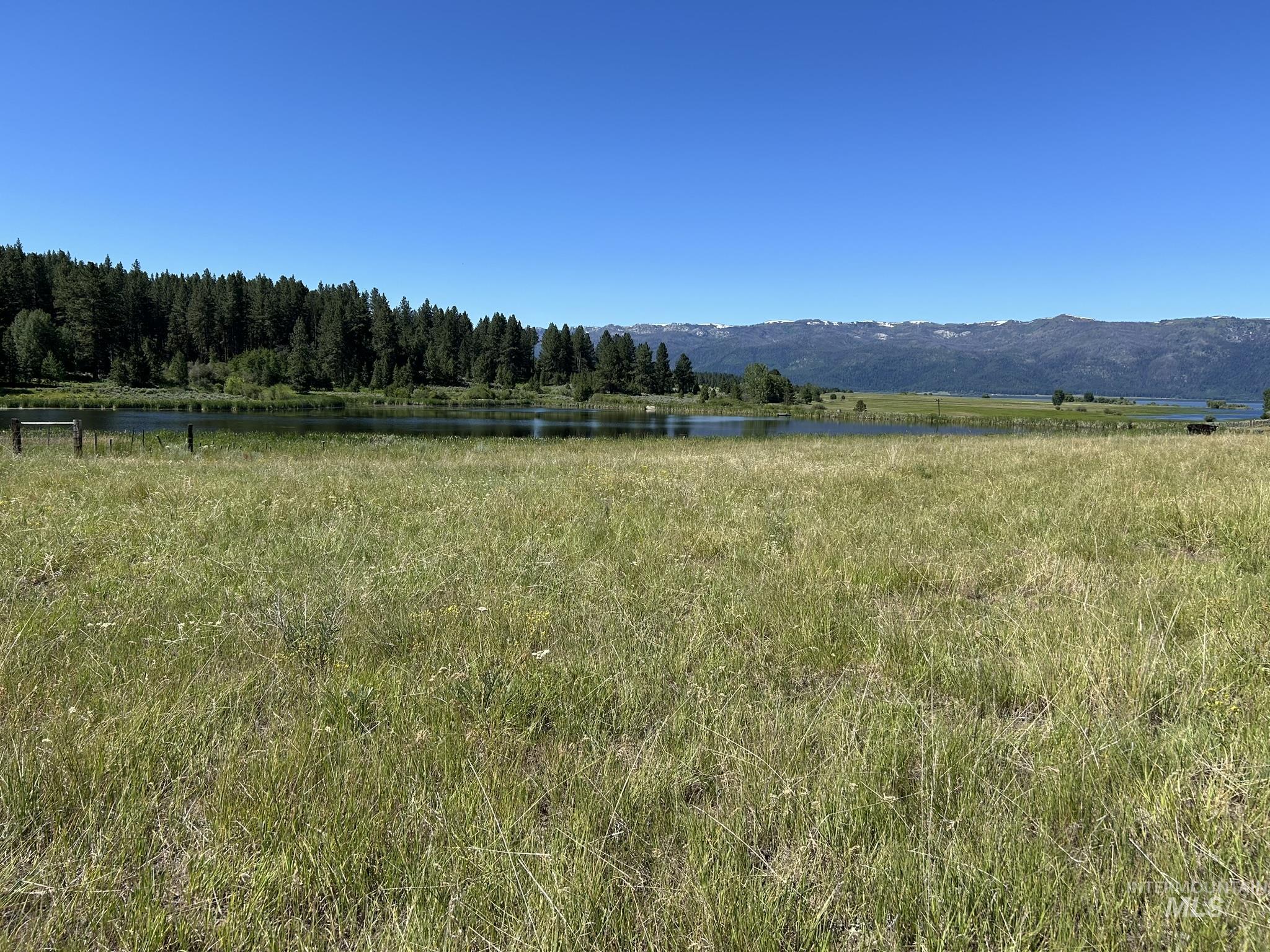 View of mountain backdrop with a nearby body of water