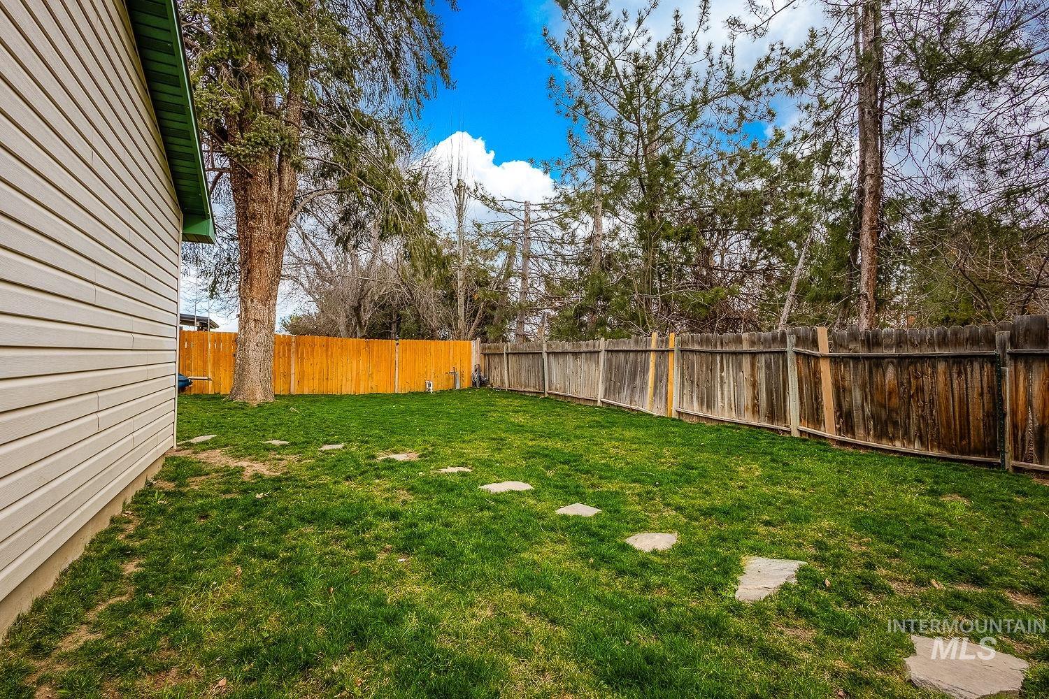 View of fenced backyard
