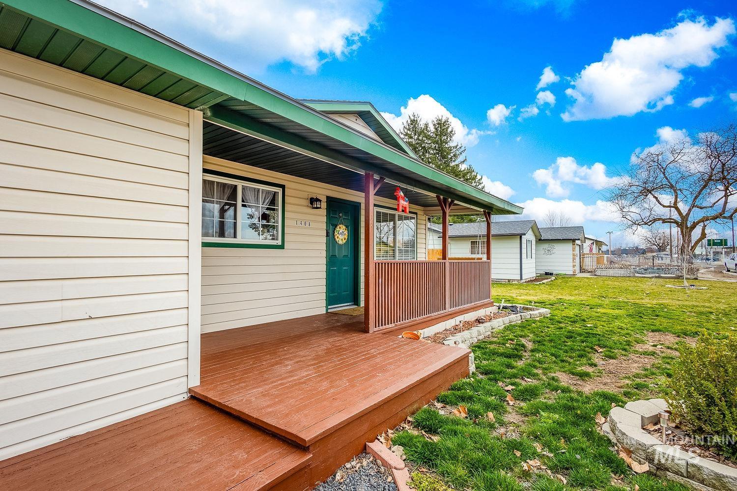Wooden porch with a yard