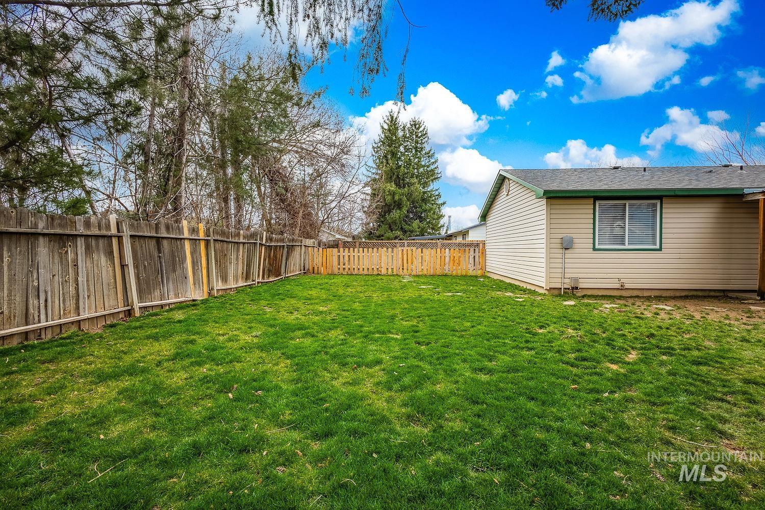 View of fenced backyard