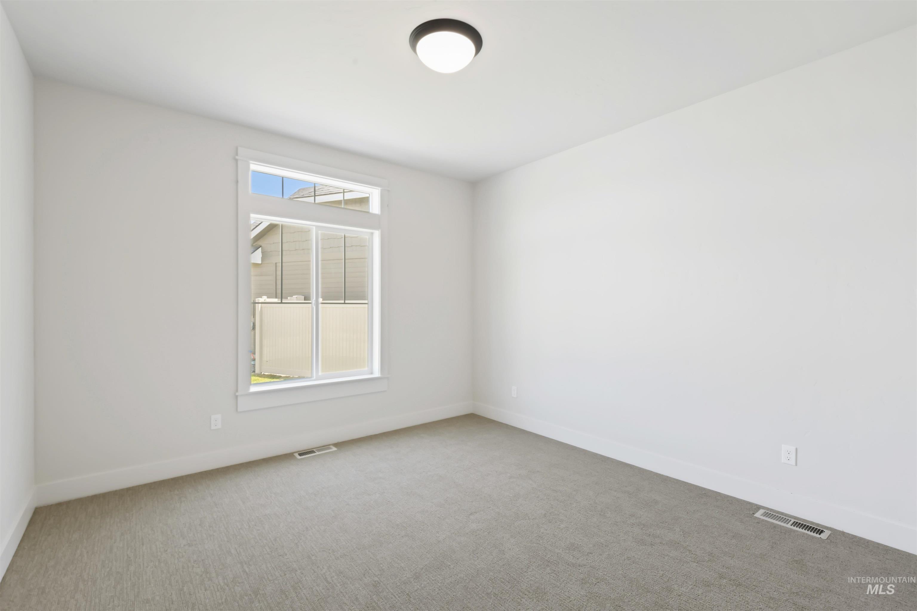 Unfurnished room featuring carpet