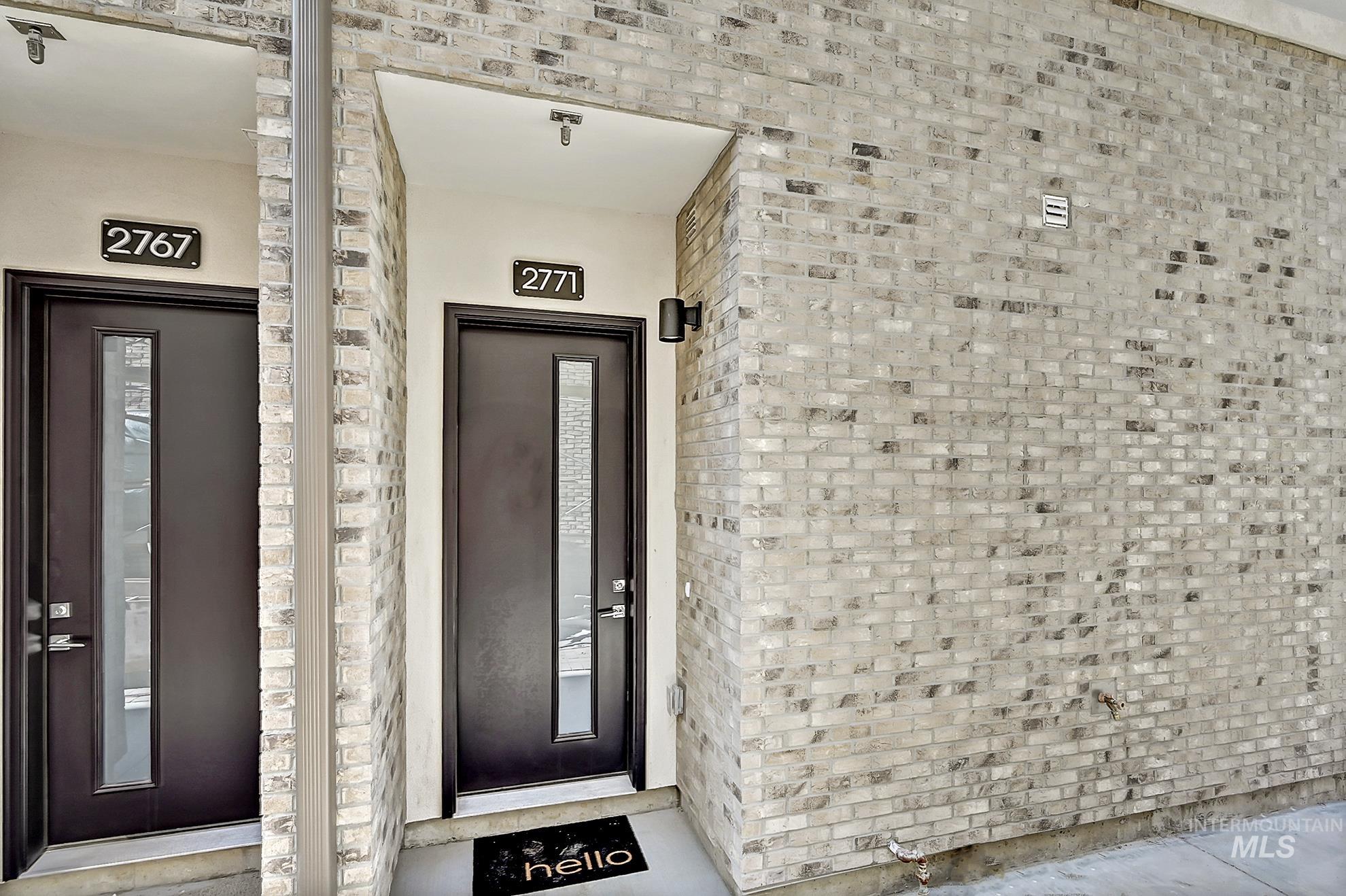 Property entrance with brick siding