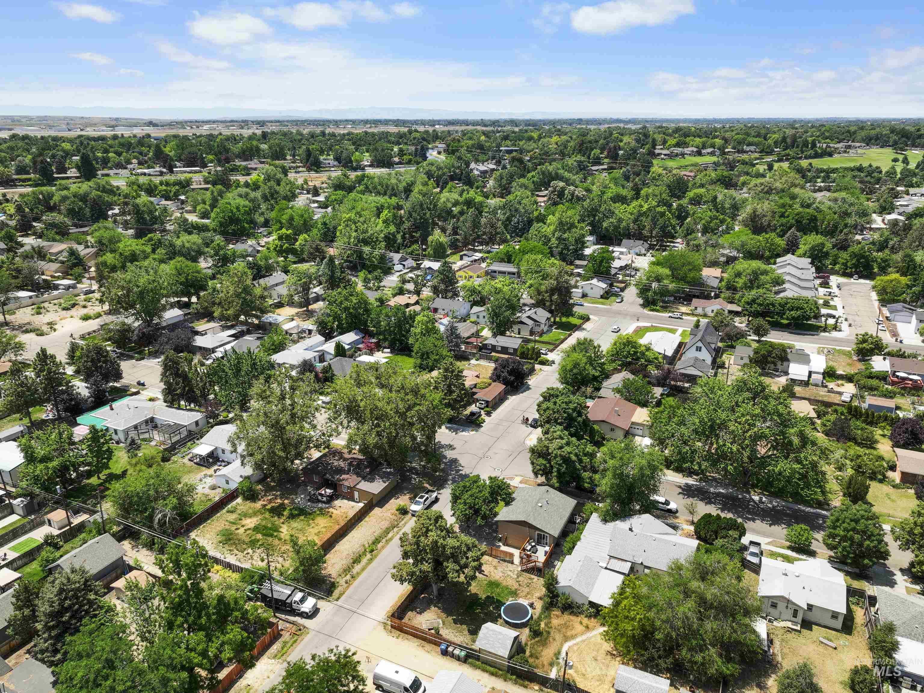 Aerial overview of property's location featuring nearby suburban area
