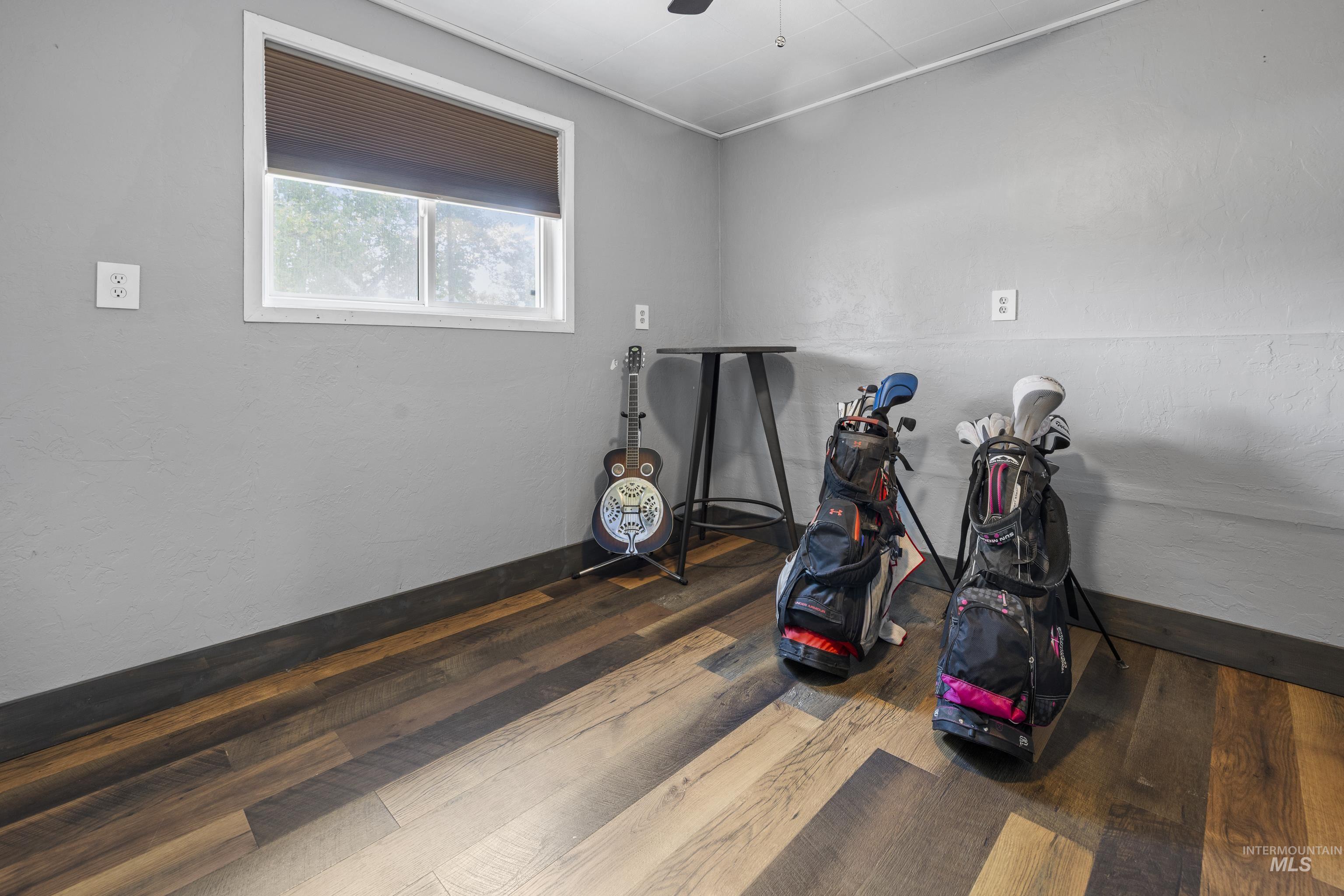 Game room featuring wood finished floors and ceiling fan
