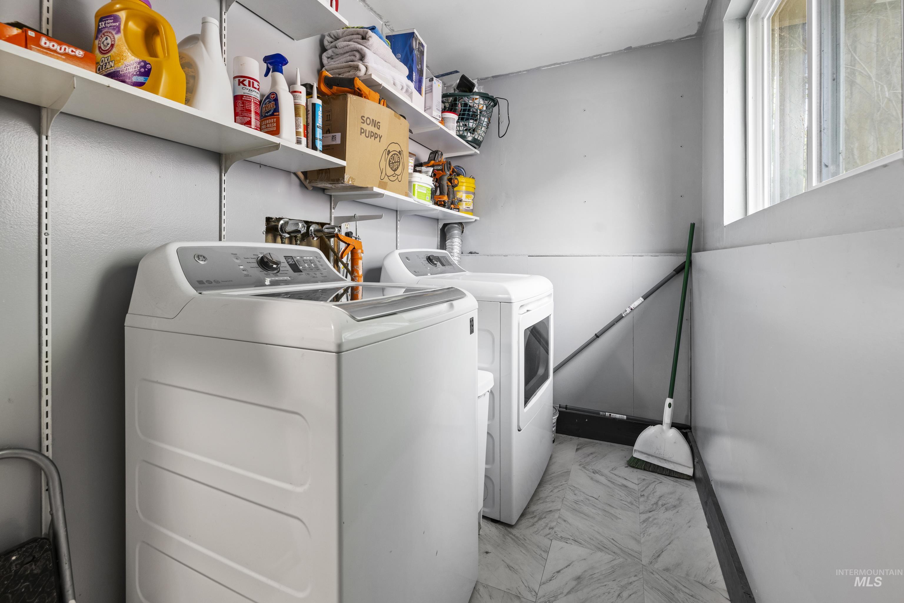 Laundry area with washer and clothes dryer