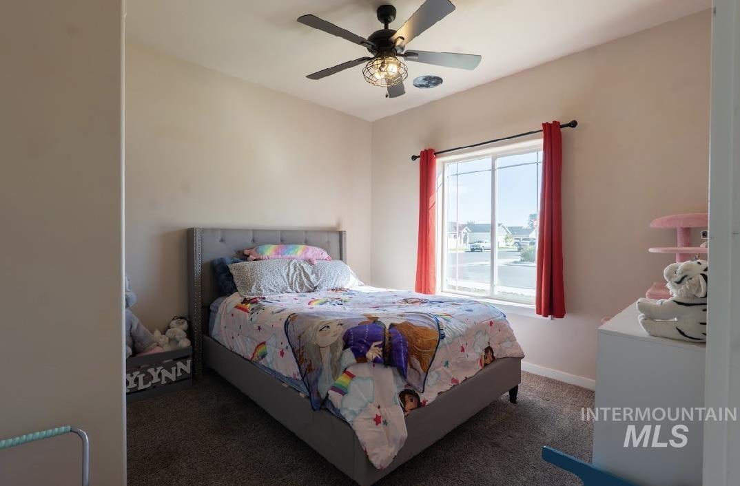 Bedroom featuring carpet floors and a ceiling fan