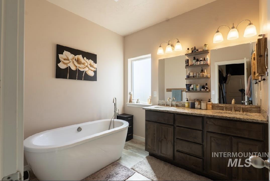 Full bath with a freestanding tub and double vanity