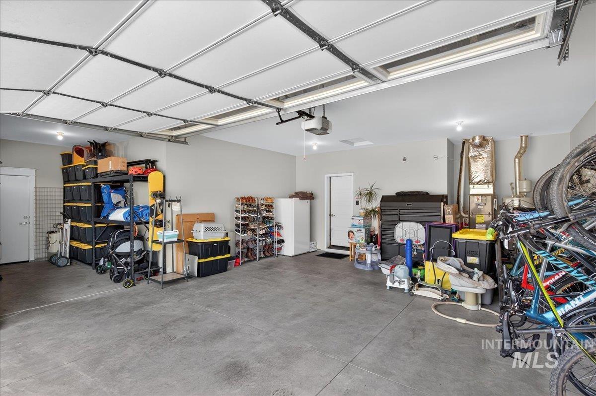 Garage featuring a garage door opener