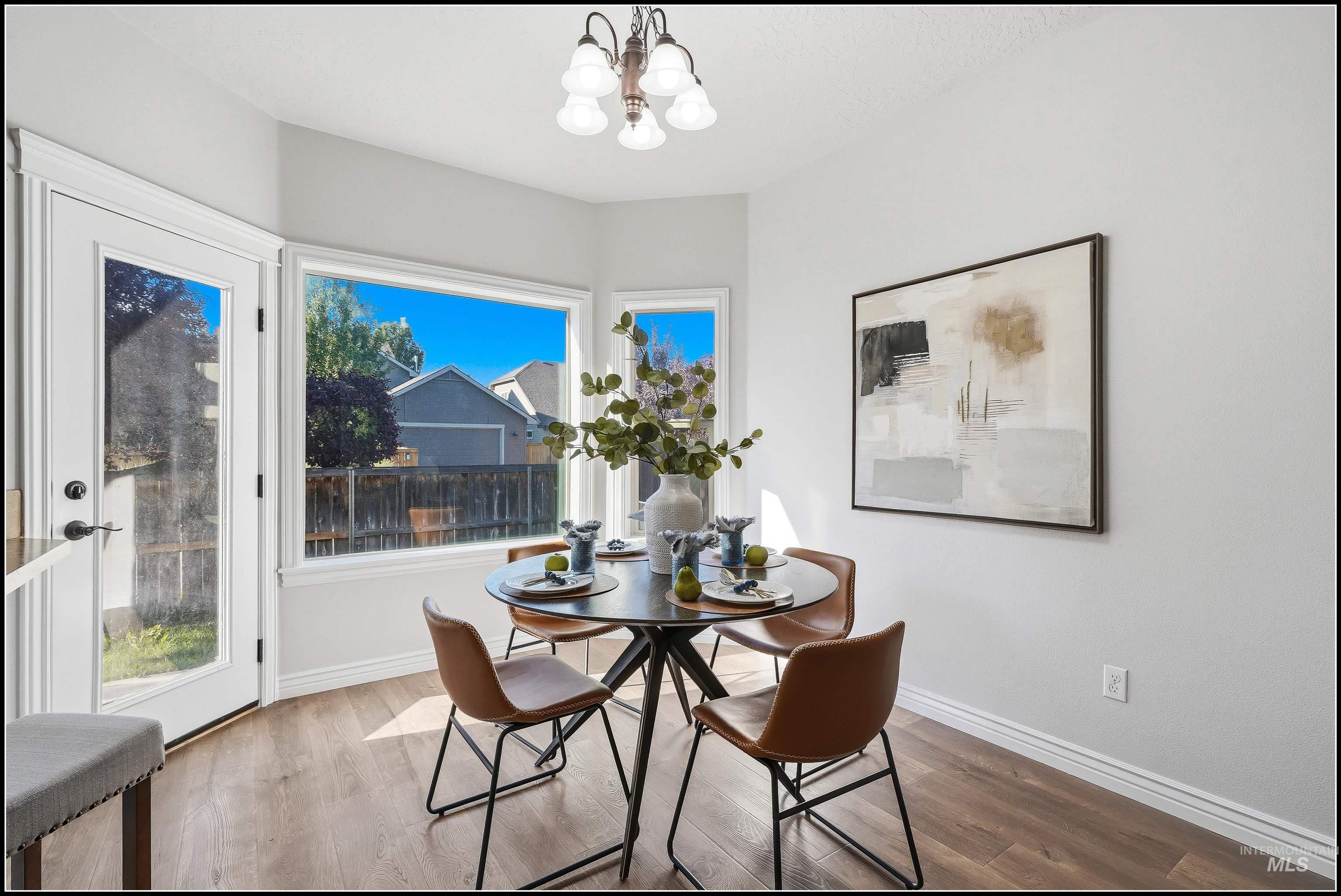 Breakfast nook featuring a bay window, and a glass-paneled exterior door