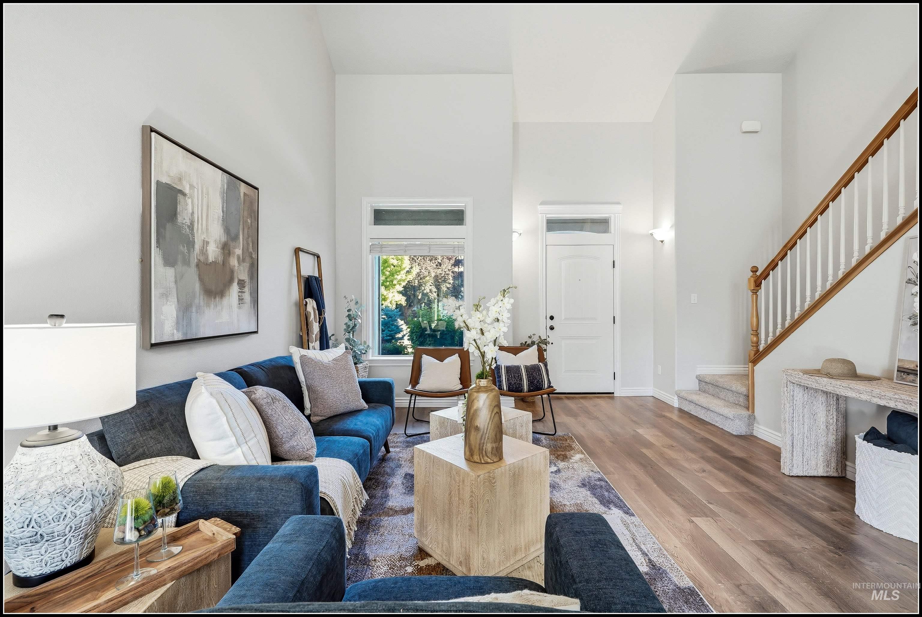 Vaulted ceilings featuring a spacious living area