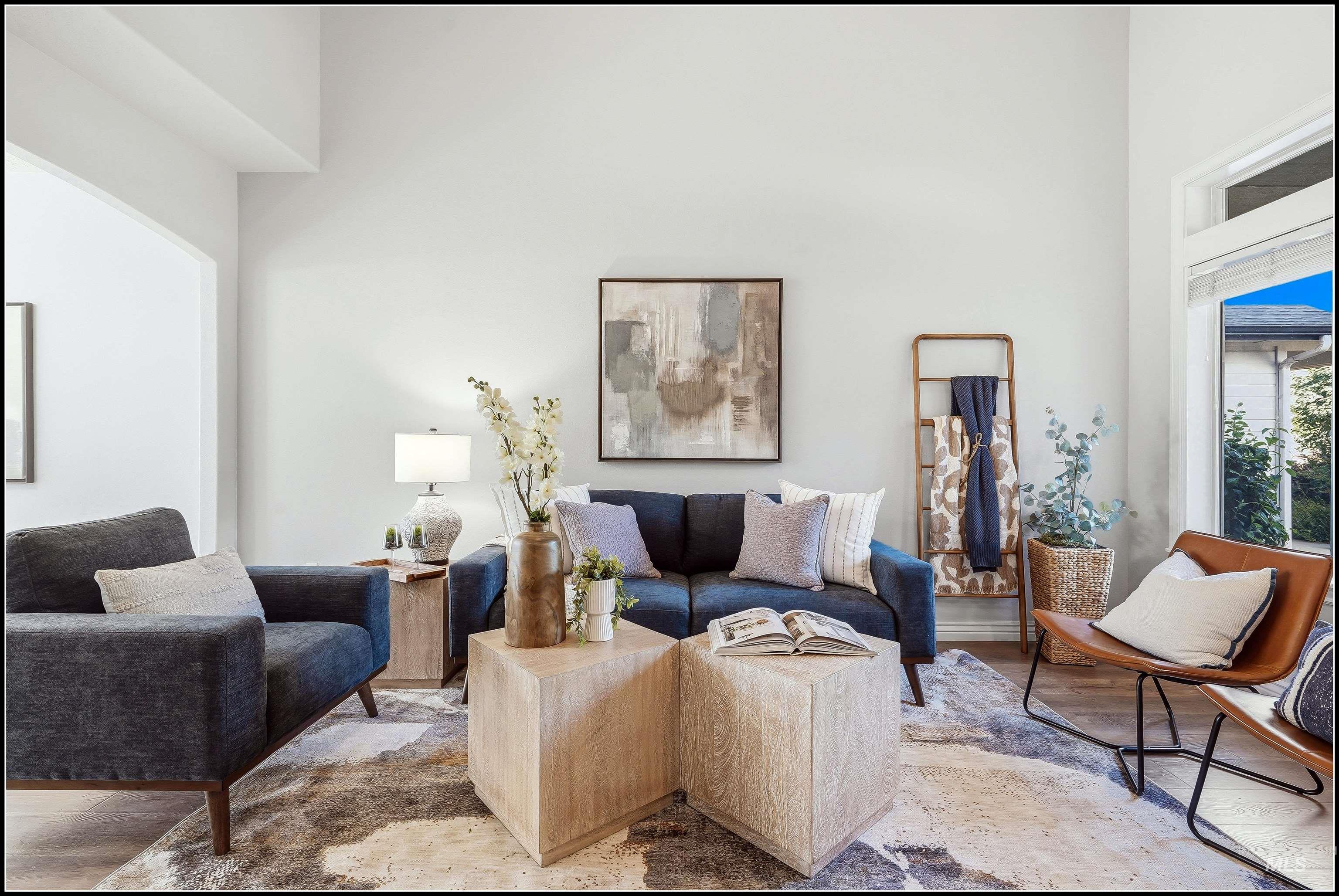 Great room featuring light-toned walls, and wood-finish flooring