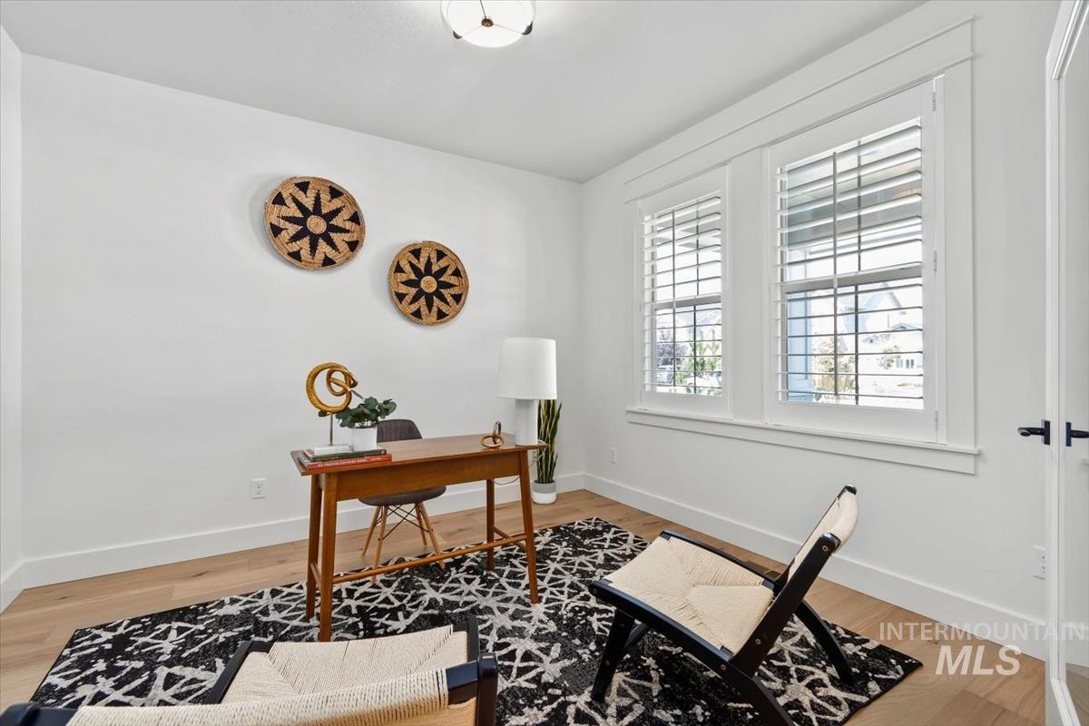 Home office featuring baseboards and light wood-type flooring