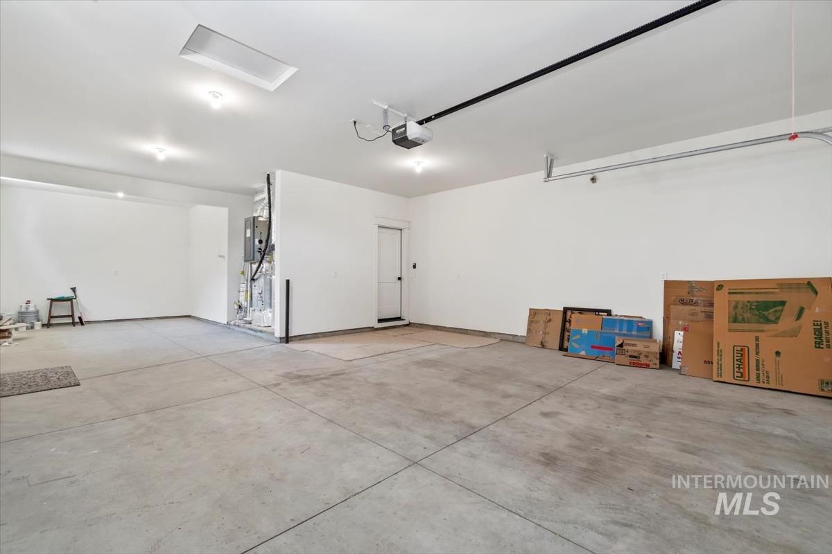 Garage featuring a garage door opener