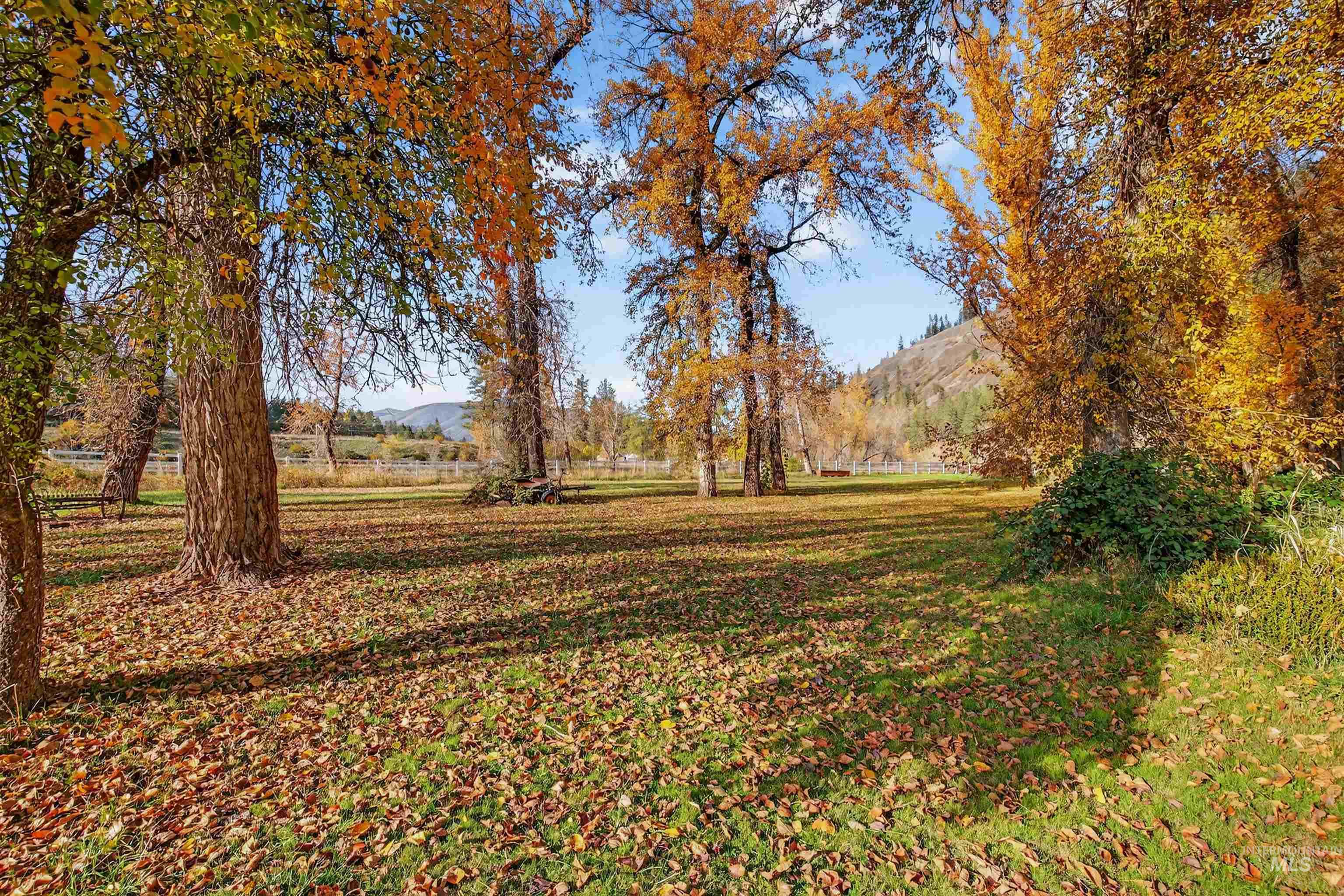 View of green lawn featuring a mountain view