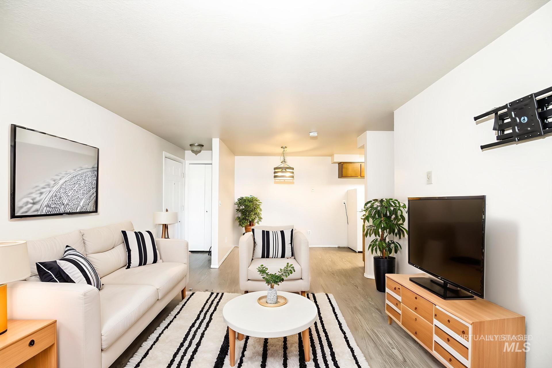 Living area featuring light wood-style floors