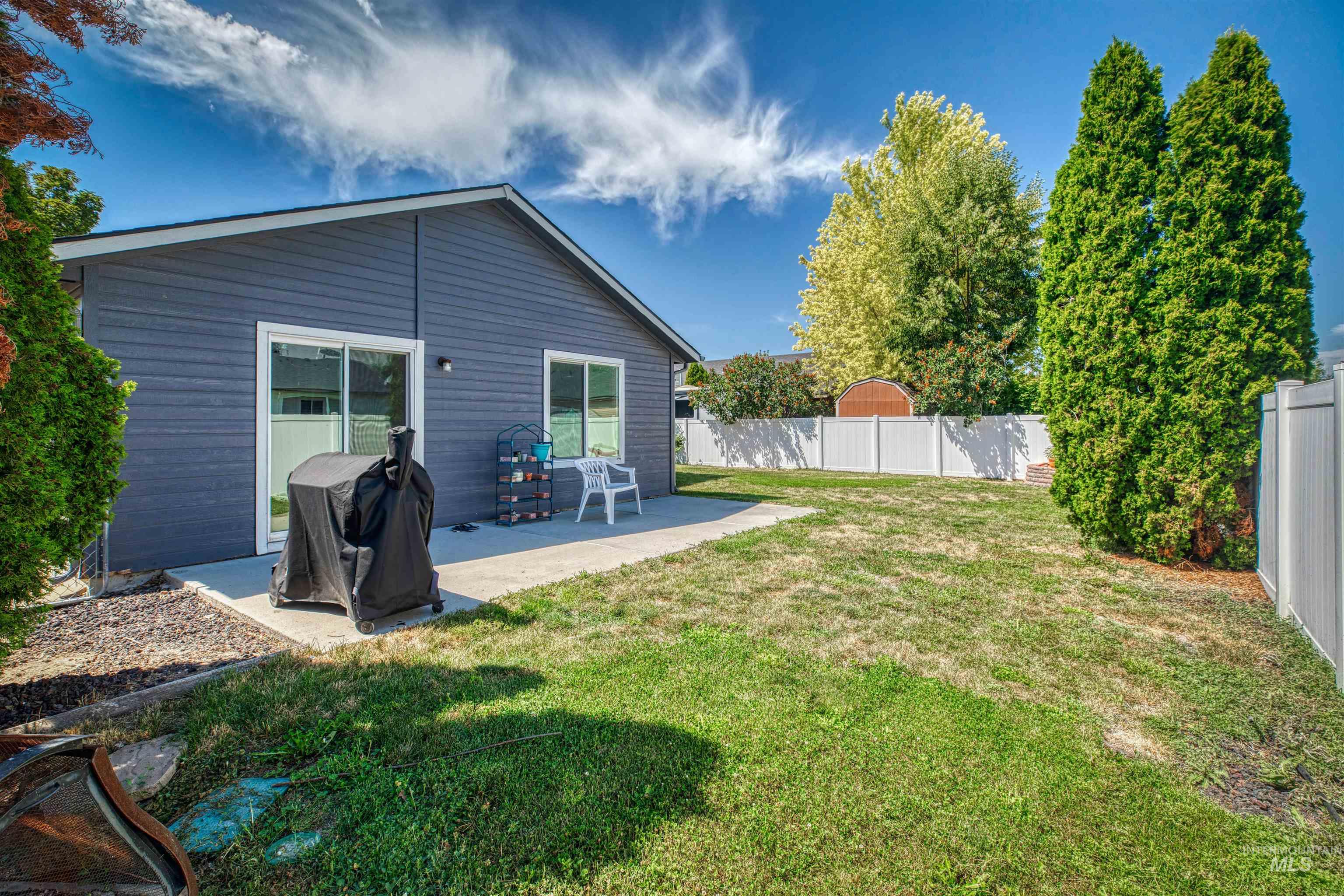 Back of property with a patio and a fenced backyard