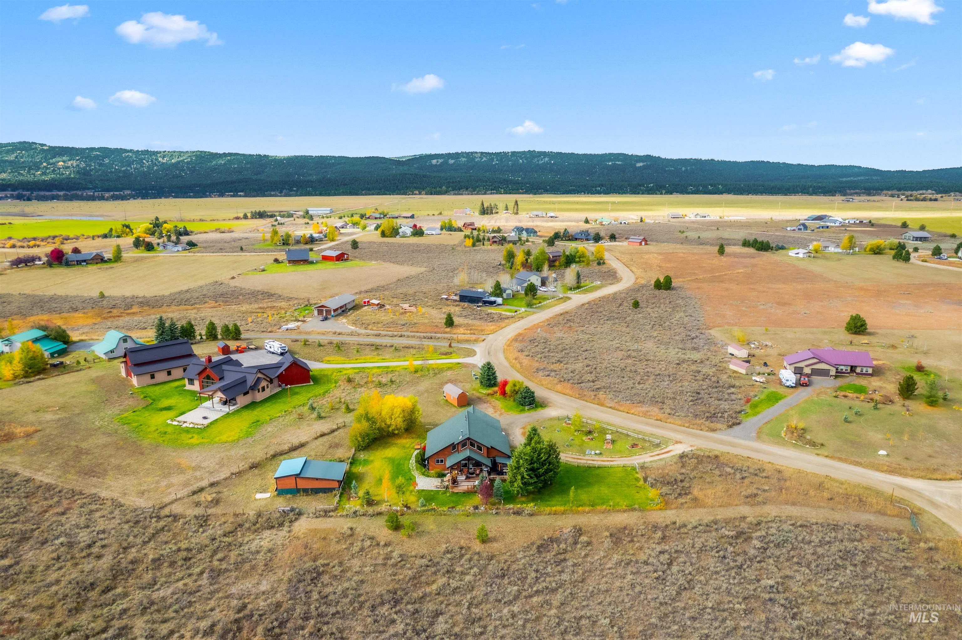 Overview of rural landscape featuring a mountain backdrop