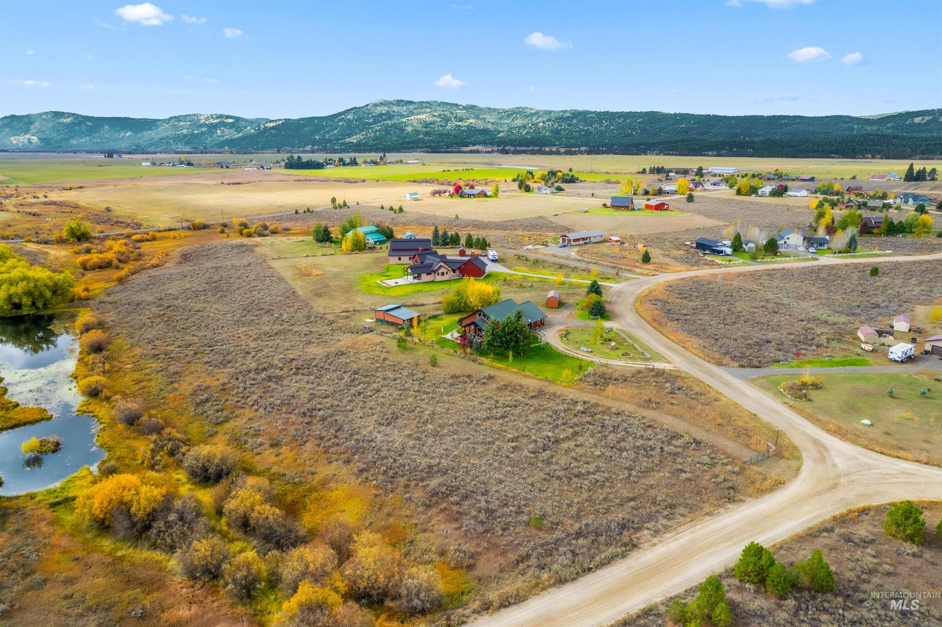 Overview of rural landscape featuring a mountain backdrop